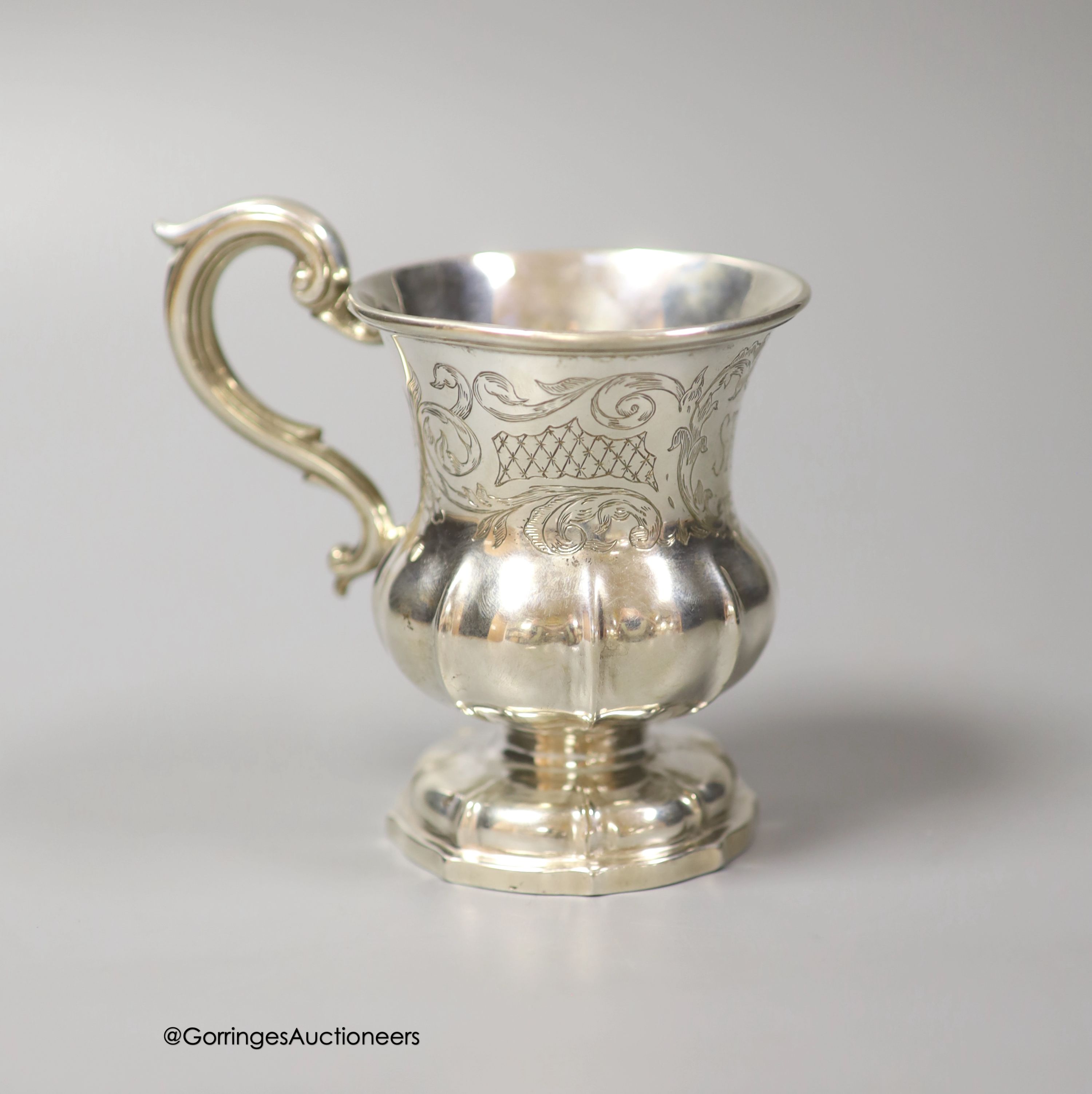 A mid 19th century Indian Colonial white metal vase shaped christening mug, by George Gordon & Co, Madras, (1821-1845) height 10.5cm, 5oz.